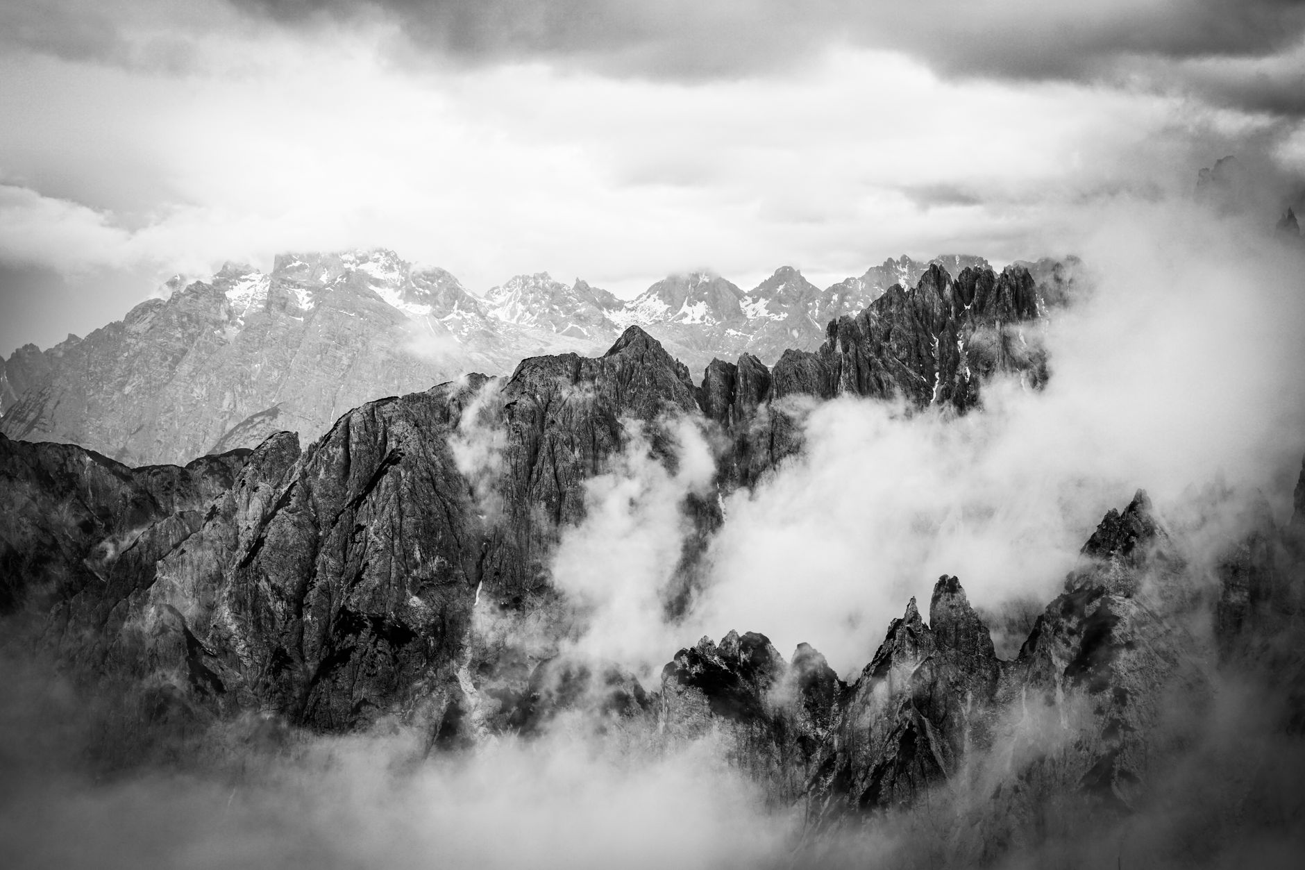 Towering limestone peaks in Alpine fog